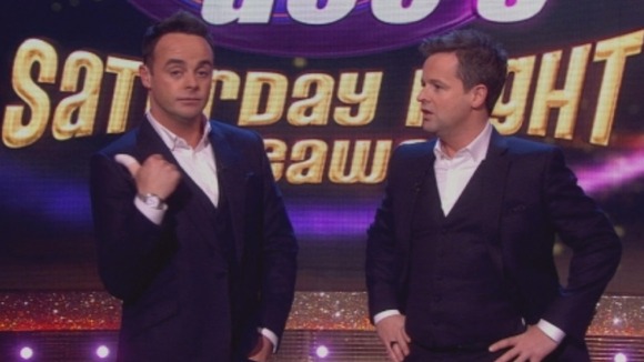 Ant McPartlin shows Declan Donnelly he will never hitchhike again/.
