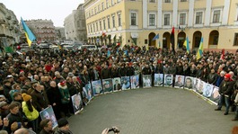 People gather to commemorate the victims of the recent clashes in Kiev.
