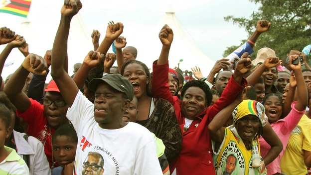 The crowd cheers for Zimbabwean President Robert Mugabe at his birthday celebrations>