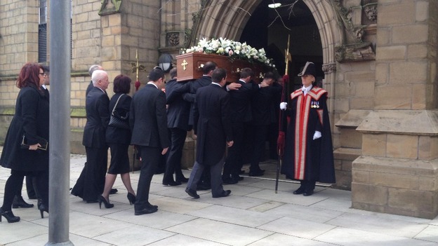 Sir Tom Finney's coffin is carried into Preston Minster