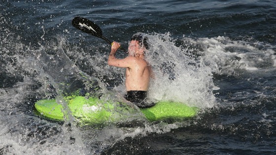 A kayaker cools off in the water at Bray, Co. Dublin as the warm weather continues across Ireland