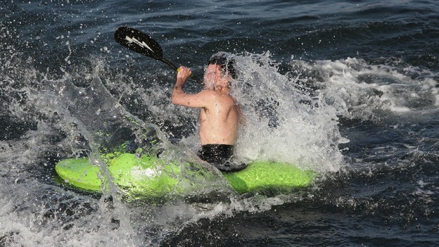 A kayaker cools off in the water at Bray, Co. Dublin as the warm weather continues across Ireland