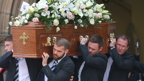 Preston players past and present, along with current manager Simon Grayson (far right) carry Sir Tom's coffin from Preston Minster
