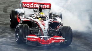Lewis Hamilton performs a donut in his F1 car
