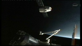 The SpaceX Dragon commercial cargo spacecraft docks at the International Space Station