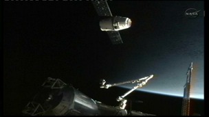 The SpaceX Dragon commercial cargo spacecraft docks at the International Space Station