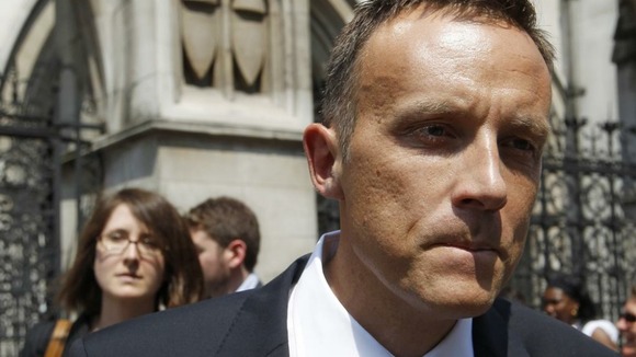 Fred Michel, a lobbyist who worked for BSkyB, walks out of the High Court where he was giving evidence to the Leveson Inquiry