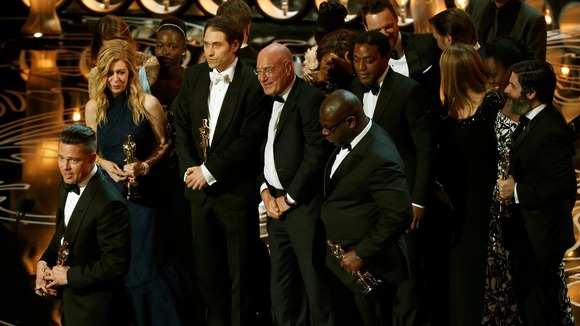 Producer Brad Pitt takes to the stage with the rest of the Oscar-winning Best Picture cast and crew.
