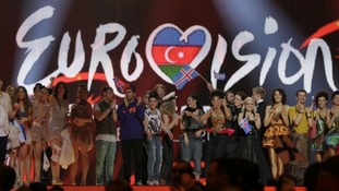 Winning contestants celebrate on stage after the first semi-final of the Eurovision song contest in Baku