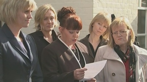 Cpl Ellement's sister, Sharon Hardy, reads a statement surrounded by family