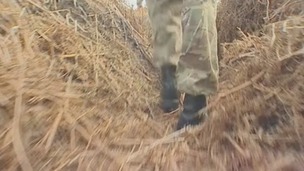 A soldier walks through the trenches in the heathland of Gosport, Hampshire.