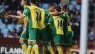 Wes Hoolahan is embraced by his teammates after scoring against Aston Villa.