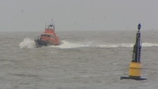 Man dies and two missing as boat capsizes off Suffolk