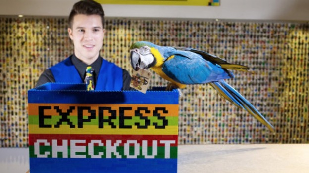 Charlie gives a hand at the checkouts