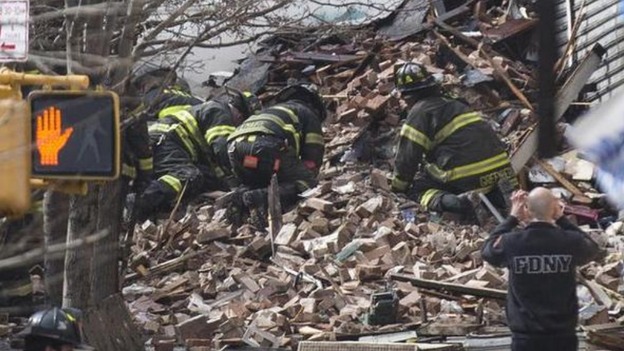 New York City Firefighters dig through the rubble