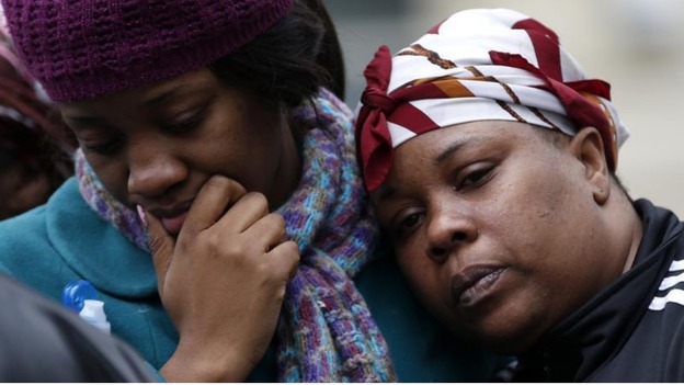 Residents take solace at the scene