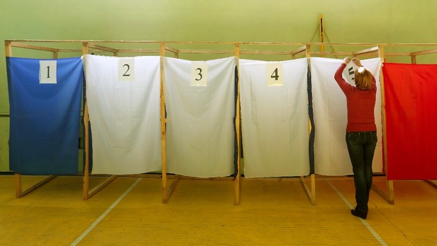 An election commission official takes part in the preparations for a referendum at the polling station in the Crimean town of Simferopol.