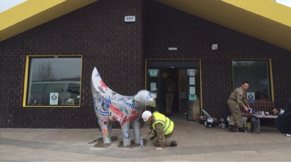 An Engineer Regiment soldier cements a 'Superlambanana' in place