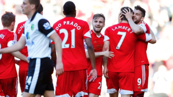Southampton players embrace Jay Rodriguez after he scores against the Canaries.