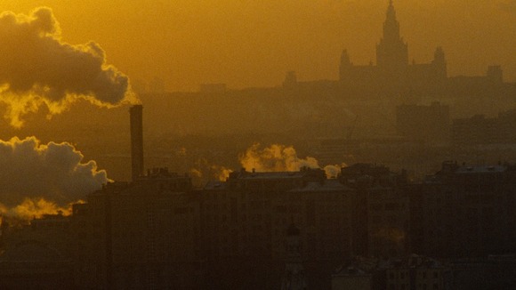 Chimney belching smoke out of a factory