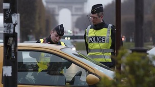 Police officers control cars with even-numbered licence plates which are not allowed to drive.