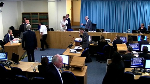 Protester calls Blair a war criminal at Leveson Inquiry.