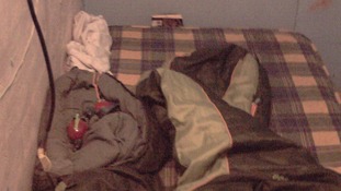 The boy's bed inside the converted coal bunker