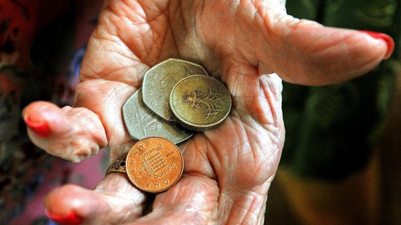 A hand holds money