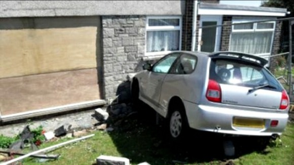Car hit house in Barry