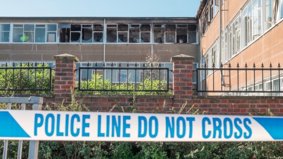 Police tape outside fire-damaged Millais School