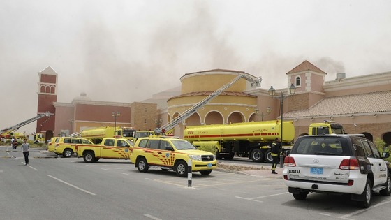  Firefighters attempt to extinguish a fire at the Villagio Mall in Doha