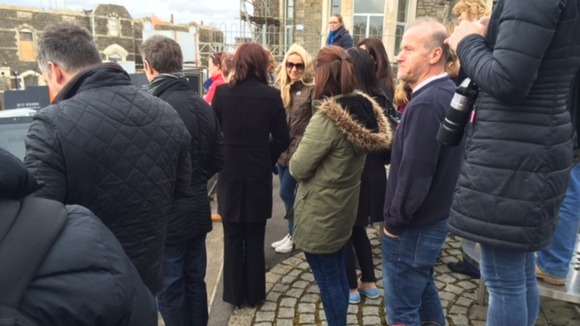Fans and locals try to catch sight of One Direction.