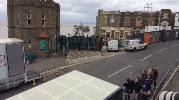 Film crews park near to the pier entrance.
