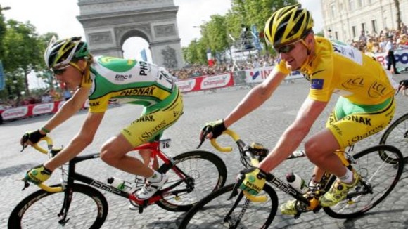 Floyd Landis (right) on the Champs-Elysees
