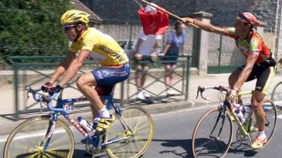 Armstrong (left) winning the first of seven consecutive titles