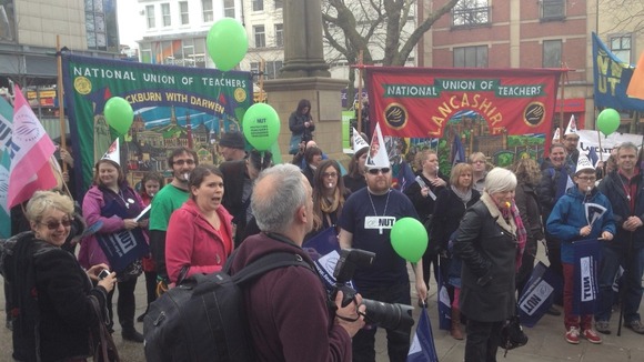 Teachers with banners, balloons and whistles at rally in Preston