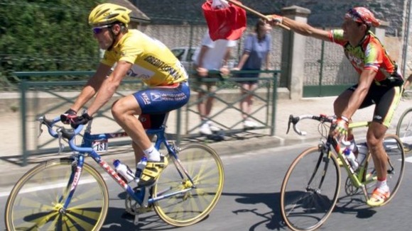 Armstrong (left) winning the first of his titles which would later be stripped from him