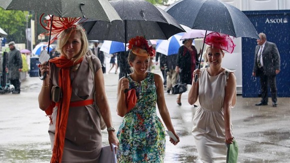 Women arrive for Ladies Day, the third day of racing at Royal Ascot in southern England