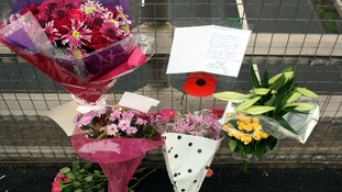 Flowers and tributes left on a bridge overlooking the M5 at Taunton, Somerset