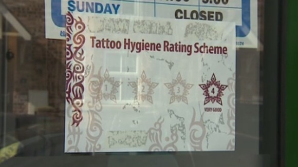 A sticker in the window of a salon achieving full marks in the new hygiene rating system.