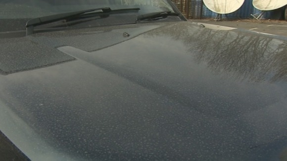 A car speckled with dust brought in from the Sahara.