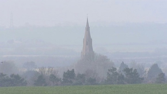 The Church of St Peter & St Paul in Alconbury in Cambridgeshire smothered by smog.
