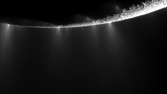 Jets of water vapour spouting from the southern polar region of Enceladus.