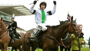 Leighton Aspell celebrates after winning the Grand National with Pineau De Re.