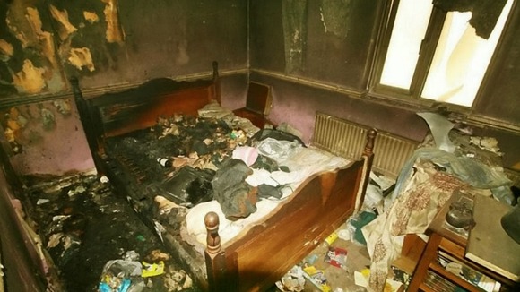 The home has been badly fire damaged, as this photo of a bedroom shows.