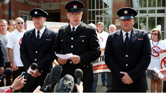 Timothy Woodward (centre) speaks to the media with Paul Simmonds (left) and Adrian Ashley (right) outside court