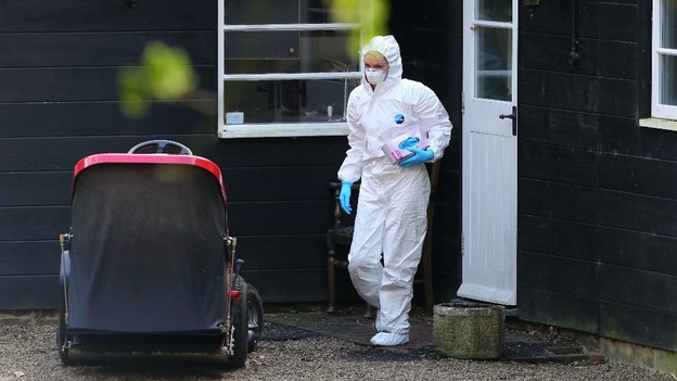 A forensics officer searches the house following the death of 25-year-old Peaches Geldof.