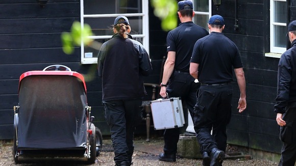 Police officers arrive at the home in Wrotham, Kent.