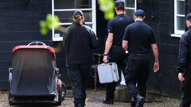 Police officers arrive at the home in Wrotham, Kent.