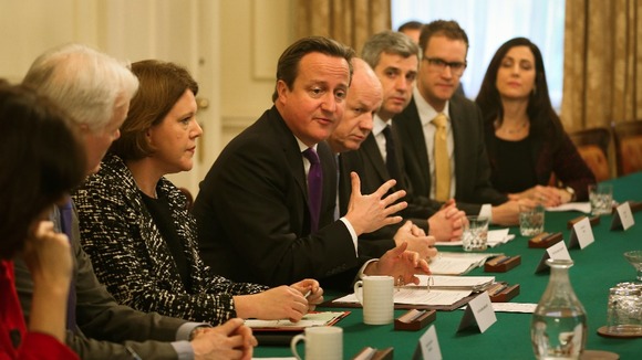 David Cameron sits alongside Mrs Miller at a Cabinet Office.